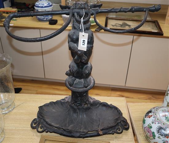 A Victorian cast iron dog and whip stick stand height 60cm
